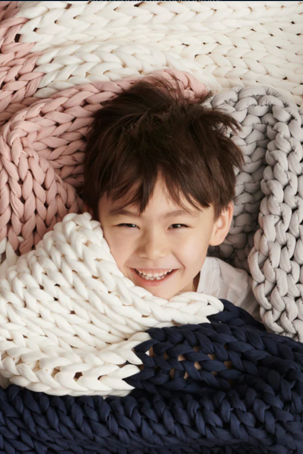 Cool gift for 8-year-olds: The organic cotton Nappling weighted blanket for kids from Bearaby