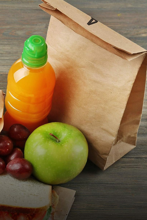 Disposable brown paper lunch bags that are made from recycled Kraft paper and are biodegradable too