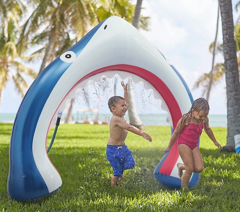 Cool backyard water toys for kids: Da dum. Da dum. Da dum. This inflatable shark sprinkler is THE toy for summer.